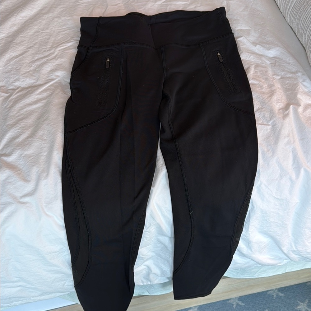 Black High-Waisted Leggings with zippered pockets and mesh ankle panels